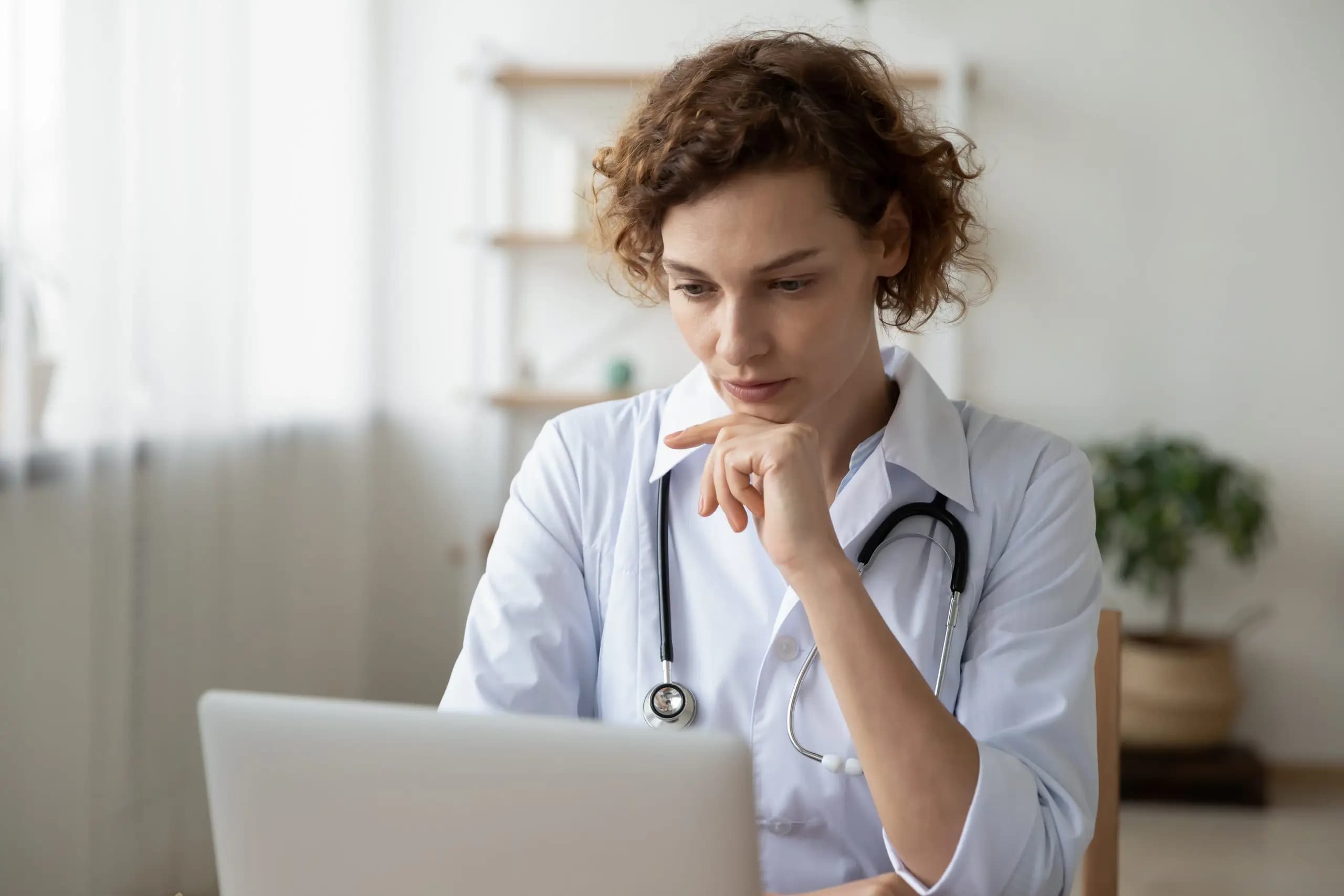 Female doctor in white coat with stethoscope